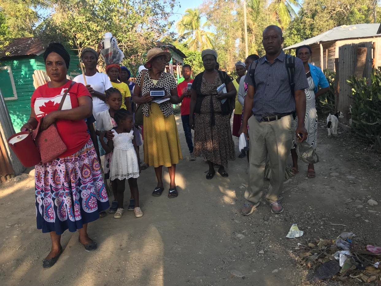 The mission team with local families